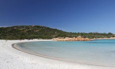 Crystal clear sea and white sandy beach of the bay Cala del principe